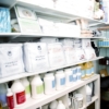 Massage Supply Store shelves of linen, oils and lotions