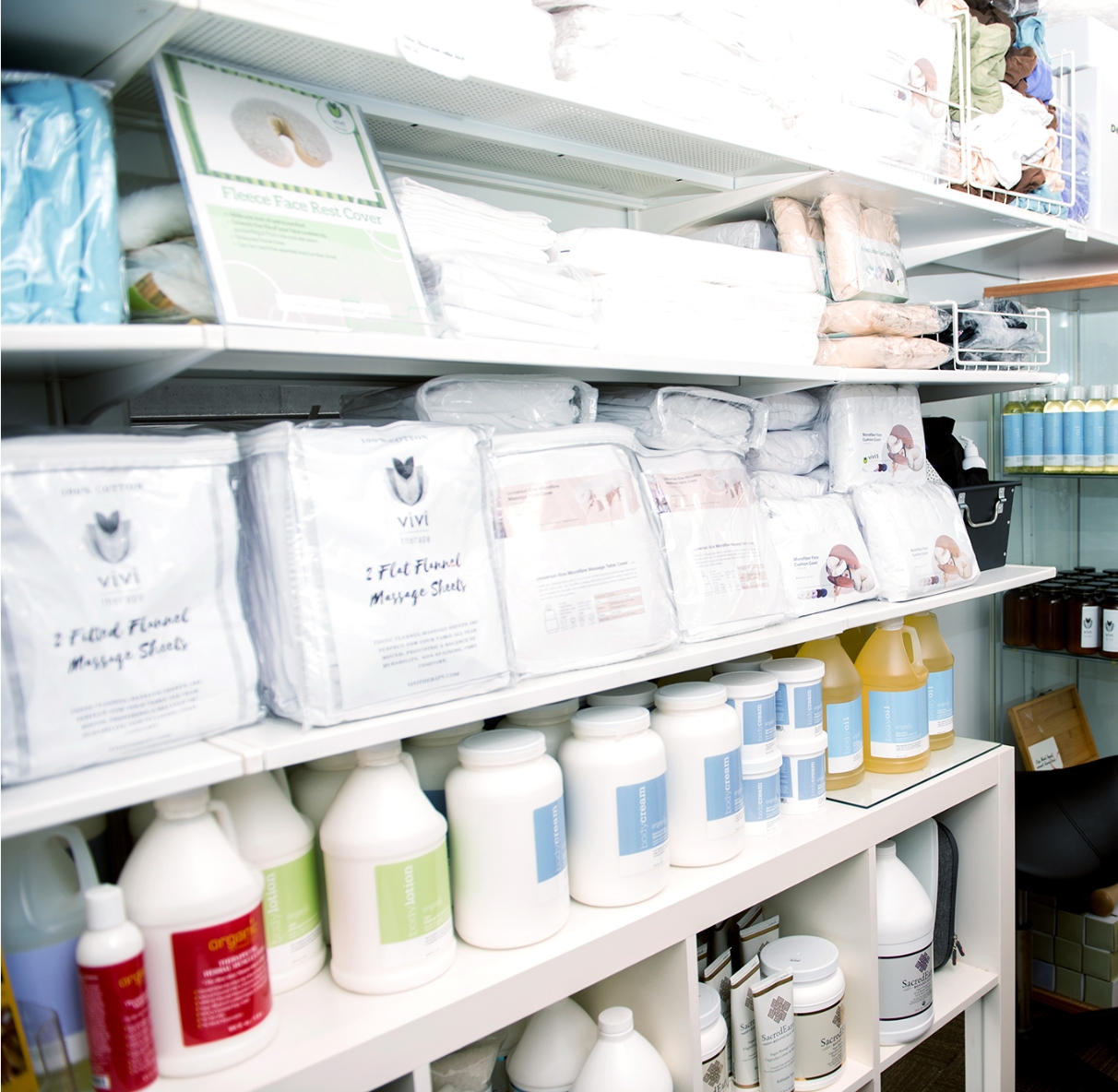 Massage Supply Store shelves of linen, oils and lotions